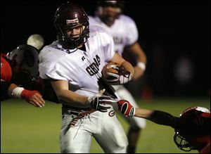 Genoa's Seth Dufendock eludes an Eastwood defender to gain yardage. The Comets improved to 6-0, 2-0 in the SLL. The Eagles are3-3, 2-1.