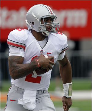 OSU's Terrelle Pryor made big plays by running but also suffered a minor thigh injury.