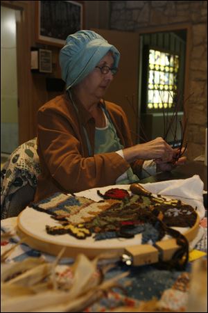 CTY pearson04p  Maumee Bay Basket Weavers Guild member Kathy (cq) Clark, of Oregon, weaving a basket at Pearson Park. The weavers participate in the St. Mark's craft show which is held on the first Saturday in November. The annual Black Swamp Festival at Pearson Metropark (cq) in Oregon, Ohio on October 3, 2010. The event is co-sponsored with Friends of Pearson. Jetta Fraser/The Blade