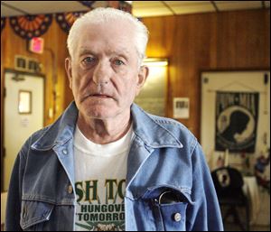 Toledoan Al Burrow, 79, a Korean War vet, defends Mr. Iott's right to express himself, but says Nazi role-playing makes him unfit for public office.