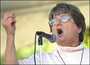 Sister Helen Prejean speaks to demonstrators outside the main gate of Fort Benning, during the 14th annual protest against a military school activists blame for Latin American human rights abuses