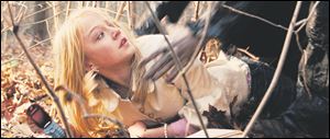 Britney, played by Paulina Olszynski, is grabbed by the Ripper in Wes Craven's ‘My Soul to Take.'