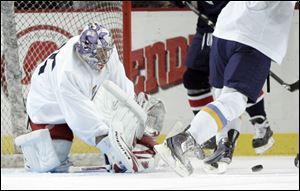 Walleye goaltender Jordan Pearce stops against Kalamazoo in a preseason game. Pearce had a 15-18 record last season.