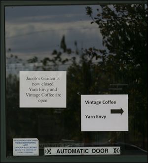 Small signs taped to the door are the only announcement of the garden store's closing. Co-owners of the two businesses that rent space in the building declined to say if they had spoken with Jacob's Garden's owner. 