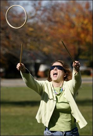 Tracy Elmore of Maumee plays a game of 'Graces' with her daughter Marissa, 10.