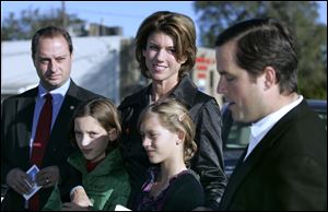 Karen Kasich, wife of Republican gubernatorial candidate John Kasich, campaigns for her husband in North Toledo. Joining her were twin daughters Reese, left, and Emma, and state Sen. Steve Buehrer (R., Delta), at far left, and State Sen. Mark Wagoner (R., Ottawa Hills).