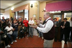 Gov. Ted Strickland thanks the volunteers outside of the phone bank center Monday.