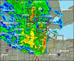A line of storms marches across Indiana, Michigan, and Ohio around midday Tuesday.