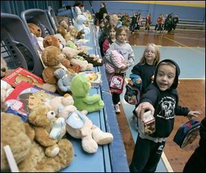 First grader D.J. Hollstein, 6, enjoys the various bears 