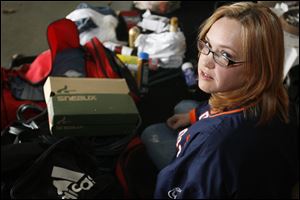 Teri Nunn, of Monroe, Michigan, says Raymond Bush dropped off a few bags of clothing, tools and miscellaneous items on Wednesday. When she went up to his car, she says she saw Taylor's body wrapped in a blanket in his car.