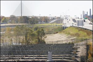 About 900 solar arrays occupy about four acres between the Greenbelt Parkway interchange and the Central Avenue overpass. The project will provide power to the Veterans' Glass City Skyway. 