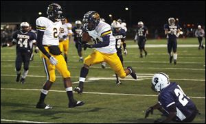Whitmer's Jody Webb scores a touchdown against Twinsburg. Webb rushed for 139 yards.
