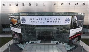 General Motors' headquarters in Detroit was dressed up for the company's return to life as a public company. GM was one of the recipients of a deeply unpopular federal bailout.