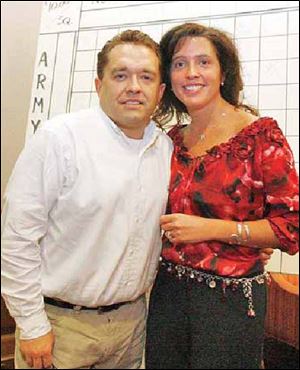 Joe and Chariss Marconi enjoy the reverse raffle at the Toledo Club.