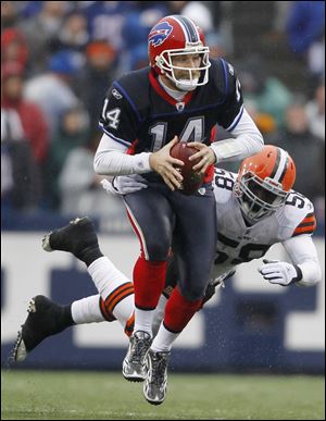 The Bills' Ryan Fitzpatrick scrambles for yardage against the Browns. He was creative enough to lead Buffalo to its third win.