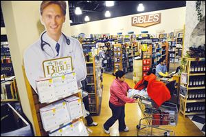 Customers shop for Christian-themed gifts at the Potomac Adventist Book & Health Food Store in Silver Spring, Md. There have been no blockbusters to drive religious-related sales this holiday season.