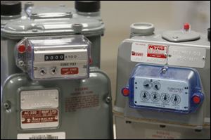 A new Columbia Gas meter, left, sits next to the model that it replaces. Customers now will be invoiced every month for actual usage, instead of receiving an estimated bill every other month. 