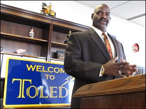 Mike Bell took office as Toledo mayor and inherited a deficit, which he managed to balance. 