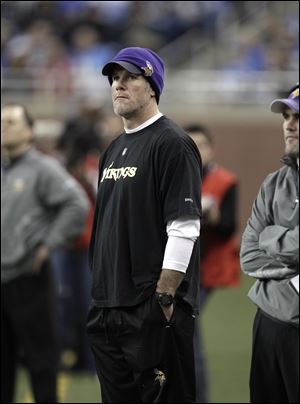 Brett Favre spent much of the game looking bored, unable to play because of a concussion. He insisted that he plans on staying retired this time.