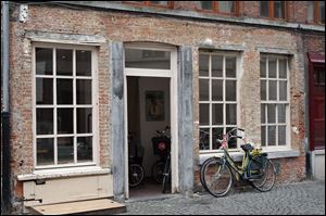 Photo 'Bicycle Repair Shop,' taken by Michele Trombley in Antwerp, Belgium, is part of the Toledo Artists' Club exhibition at the Toledo Museum of Art.