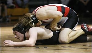  Dalton Nicely of Wauseon controls Zach Carter of Ashland in the 135-pound final at the Perrysburg Invitational Tournament. Nicely, 22-4 this year, won the championship with a pin. He also won his weight division at the Maumee Bay Classic at Clay. 