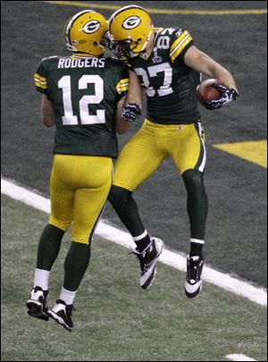 Aaron Rodgers celebrates with Jordy Nelson after Nelson's touchdown catch in the first half. Nelson had 140 yards receiving.