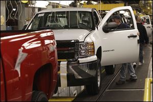 Sharing in the industry prosperity will be a focus of contract talks this year for UAW members such as these at GM's Flint truck plant. 