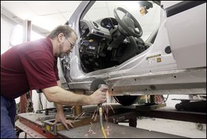 Rob Pennington, manager of Quality Collision, 2358 West Sylvania Ave., says summer usually is a better season for his repair shop.