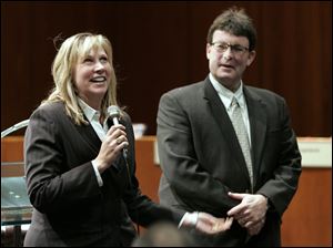 Sgt. Laurie Renz, with husband Detective Jay Gast, is a Whitmer High graduate who has been on the force since 1997.