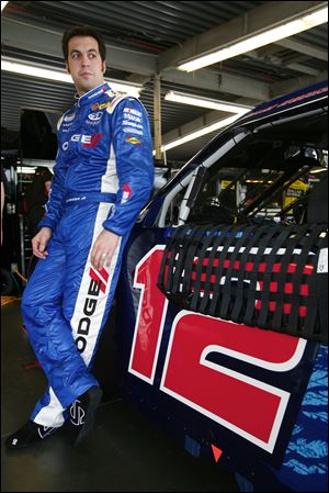 Defiance native Sam Hornish, Jr., stands next to his No. 12 Dodge Challenger SRT8 that will run Saturday at Daytona International Speedway in the Drive4COPD 300 Nationwide Series race.