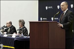 Daniel Steinbock, interim dean at the University of Toledo's college of law, makes opening remarks to about 200 participants — including lawyers, members of the corrections system, and public interest groups — at an annual symposium. 
