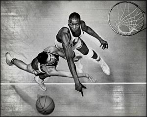 Nate Thurmond swats away a shot by a Miami player in 1962. Thurmond was a Sporting News All-American as a Bowling Green senior.