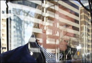 NFL Commissioner Roger Goodell goes through the revolving door as he arrives for football labor negotiations with the NFL players involving a federal mediator, Friday in Washington.