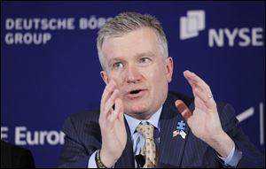 NYSE Euronext CEO Duncan Niederauer speaks during a news conference at the New York Stock Exchange, Tuesday, Feb. 15, 2011. The NYSE and Deutsche Boerse announced Tuesday that they plan to merge. (AP Photo/Mark Lennihan)