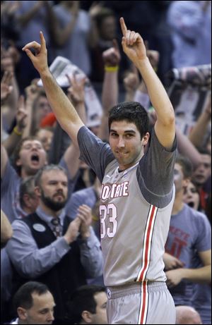 Ohio State senior Jon Diebler celebrates after the Buckeyes routed Wisconsin in his final home game. The Buckeyes avenged an earlier loss to Wisconsin by hitting a record 14-of-15 3-pointers.