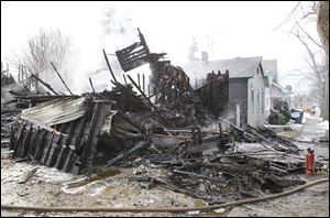 A pile of rubble is all that remains following a fire at 243 Wasaon Street in Toledo Monday morning.