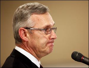 Ohio State coach Jim Tressel listens to a question from members of the media during an NCAA college football news conference, Tuesday.