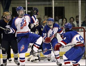Tyler Murphy, left, celebrates with Nate Opblinger, center, and Bryce Connor after scoring a goal against St. John's in the district final at Tam-O-Shanter. Murphy leads St. Francis with 43 goals and 56 assists. The Knights (32-4-1) face Powell Olentangy Liberty (27-8-1) in the state semifinals.