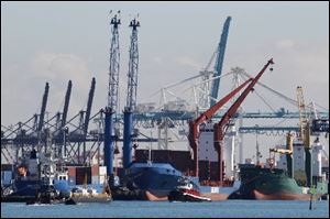 Containers are loaded onto vessels at the Port of Miami.