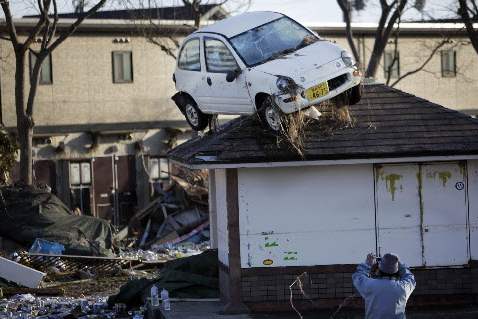 Japan-Aftermath-Sendai-car-on-roof