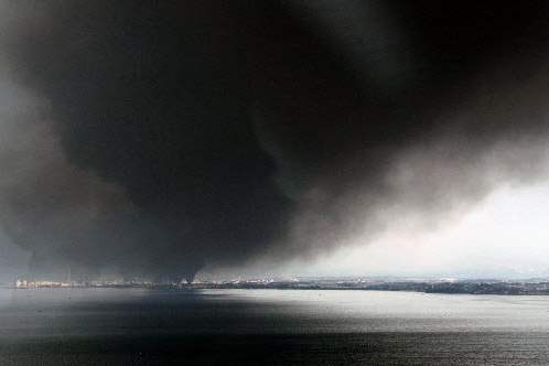 Japan-Aftermath-Tagajo-black-smoke