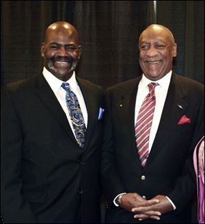 Toledo Mayor Mike Bell, left, stands with comedian Bill Cosby, who spoke to 750 with the Greater Toledo Urban League is to lead a morning rally.