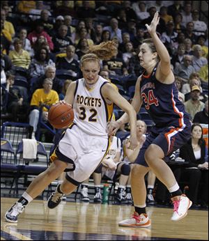 Toledo senior Melissa Goodall drives past Auburn's Peyton Davis. Goodall scored 12 points for the Rockets.