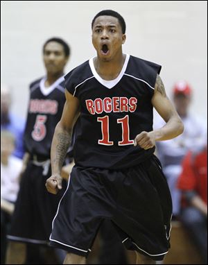 Damond Powell celebrates as time runs out on Rogers' victory over Rocky River. The Rams will advance to the D-II state semifinal.