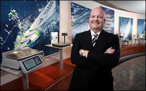 William Donnelly, the chief financial officer, says, 'Most of our products, people don't see.' With him at company headquarters is a scale that people do see, one used by grocery deli departments.