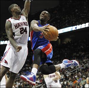 Detroit Pistons' Rodney Stuckey (3) goes to the basket as Atlanta Hawks forward Marvin Williams (24) defends Sunday.