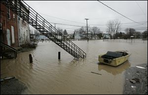 Flooding, such as this in 2008 in Findlay, is part of Ohio's losses, even though the risks are underwritten by the federal government.