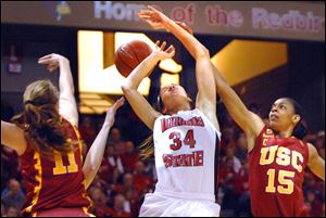 USC's Cassie Harberts, left, and Briana Gilbreath, right, hamper the shot taken by Illinos State's Hannah Spanich in their WNIT semi.