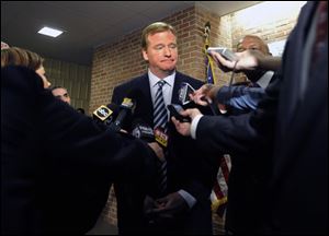 NFL Commissioner Roger Goodell talks with reporters after an assembly about the dangers of steroid use Monday at Woodlawn High School in Woodlawn, Md.