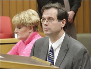 Tanya Skelton sits with her attorney, David McFarland at the hearing. She asked Judge Margaret Noe for permission to sell the house she and John Skelton shared in Morenci, Mich.
